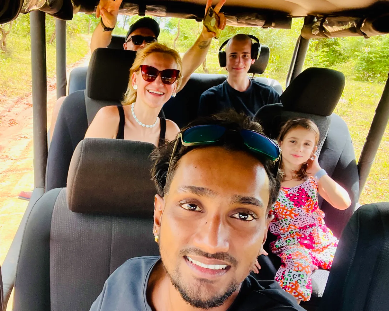 Hasitha and travellers on a safari