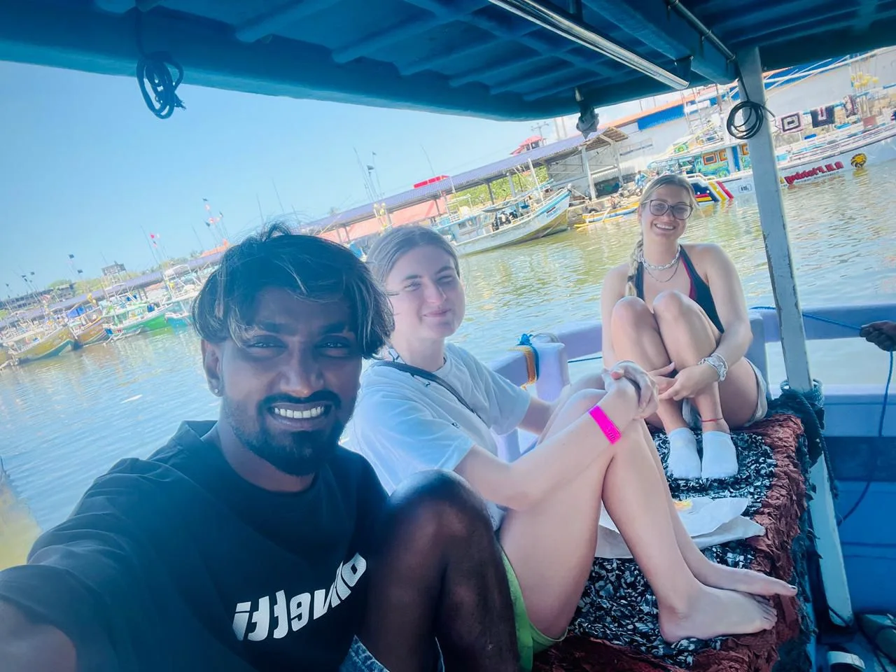 Hasitha and guests aboard a boat