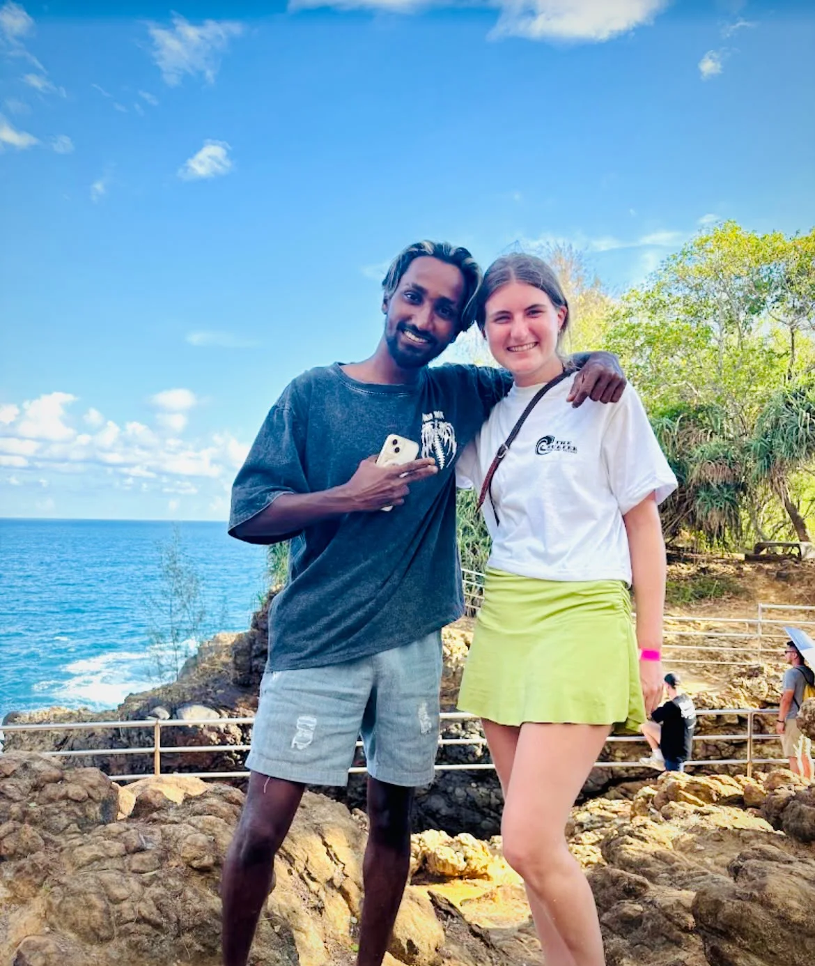 Hasitha with a guest beside the sea