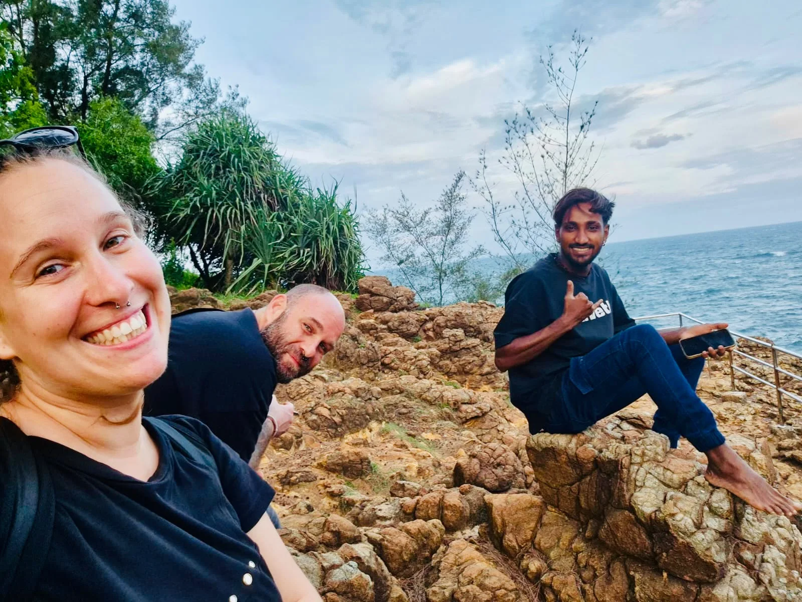 Guests sharing a moment on the rocky coast