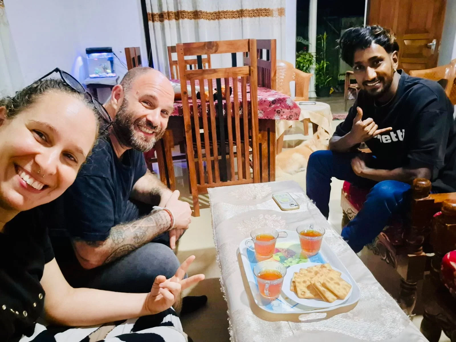 Hasitha and guests sharing a meal